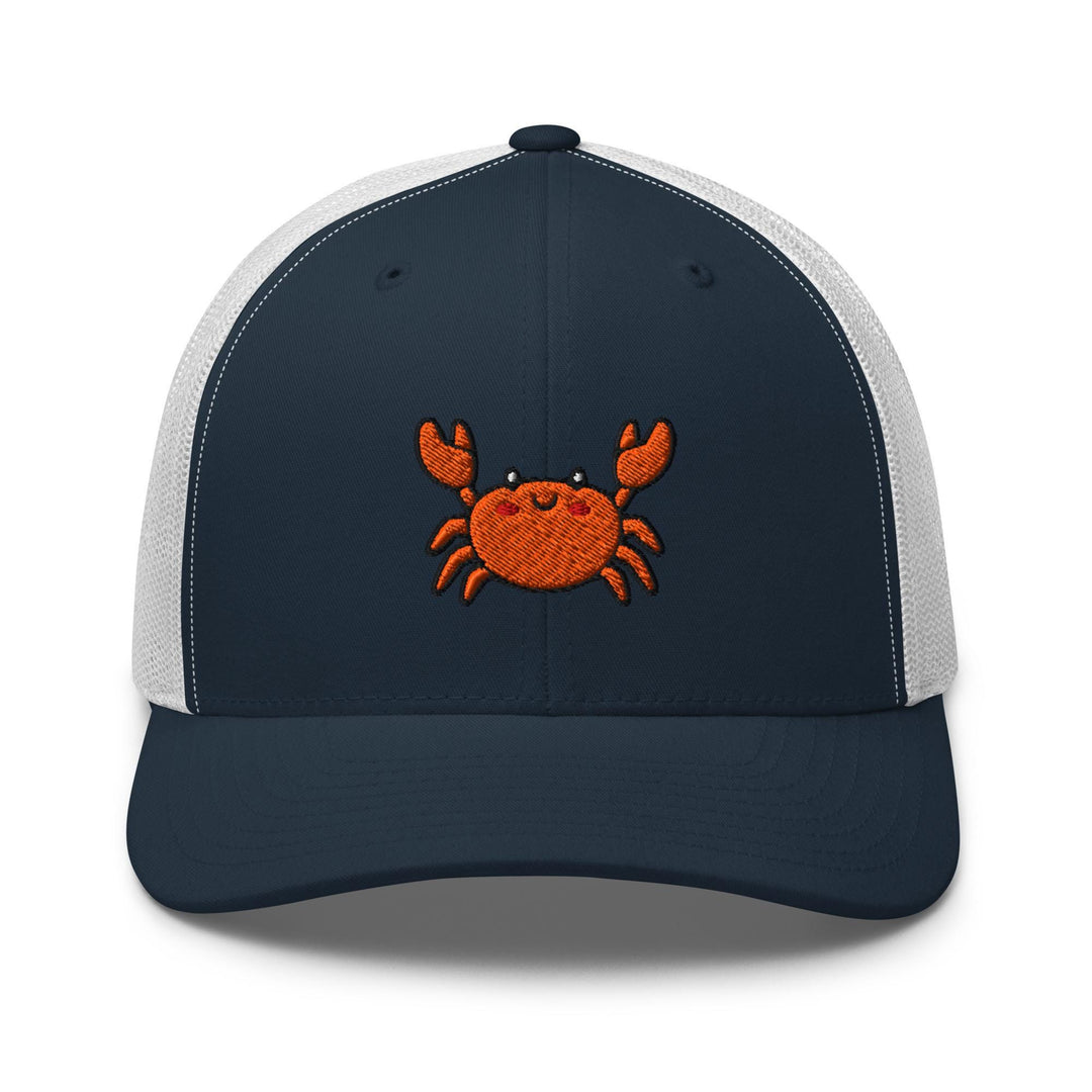 a blue and white trucker hat with a crab embroidered on the front