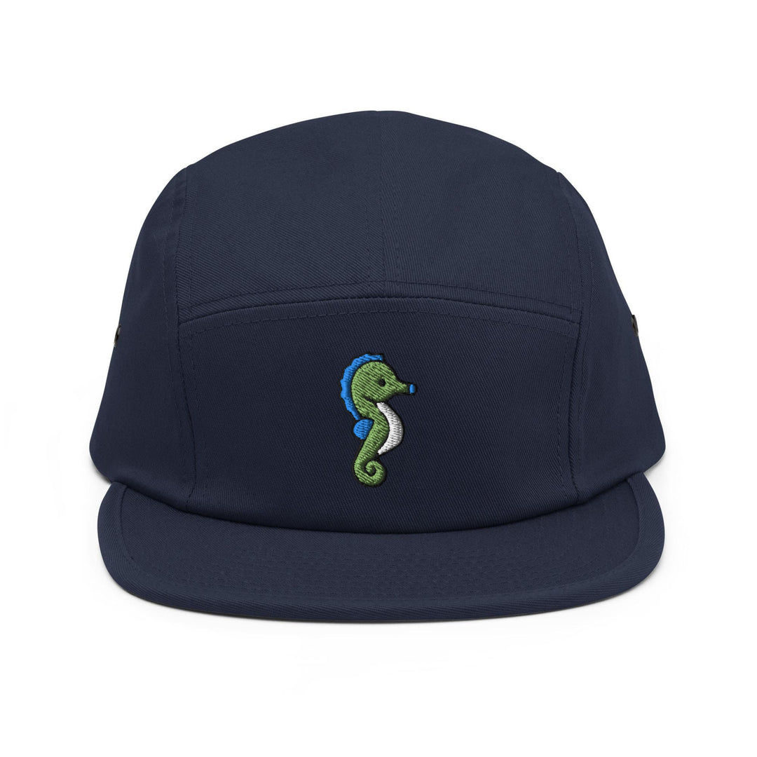 a blue hat with a green seahorse embroidered on it