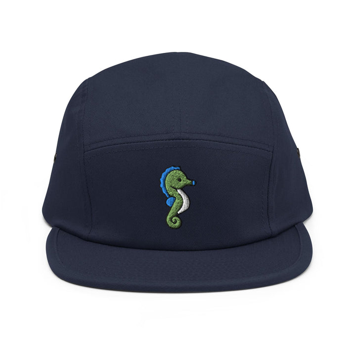 a blue hat with a green seahorse embroidered on it