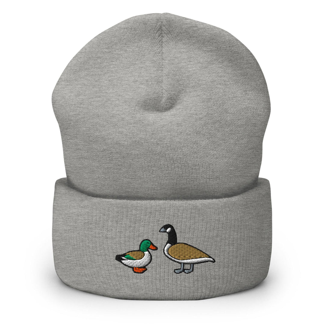 a grey beanie with two ducks on it