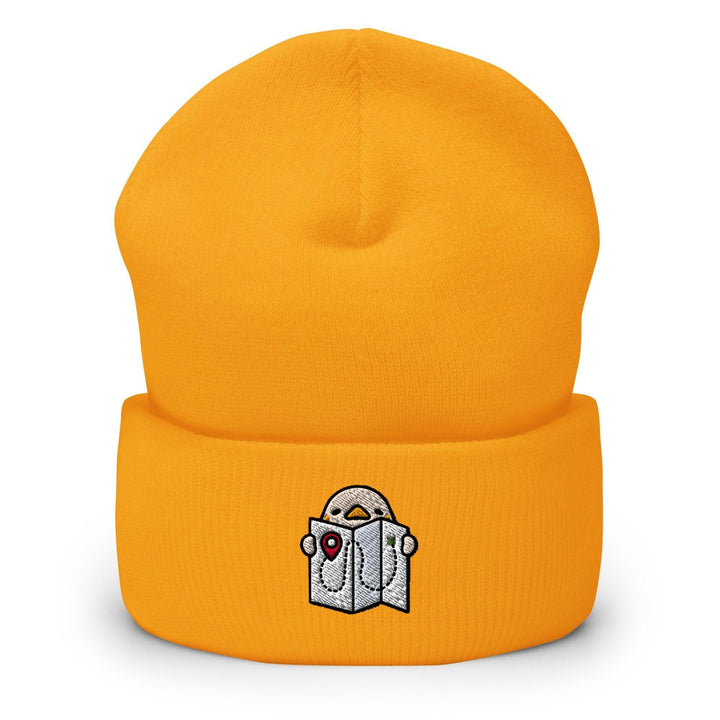 a yellow beanie with a picture of a book on it