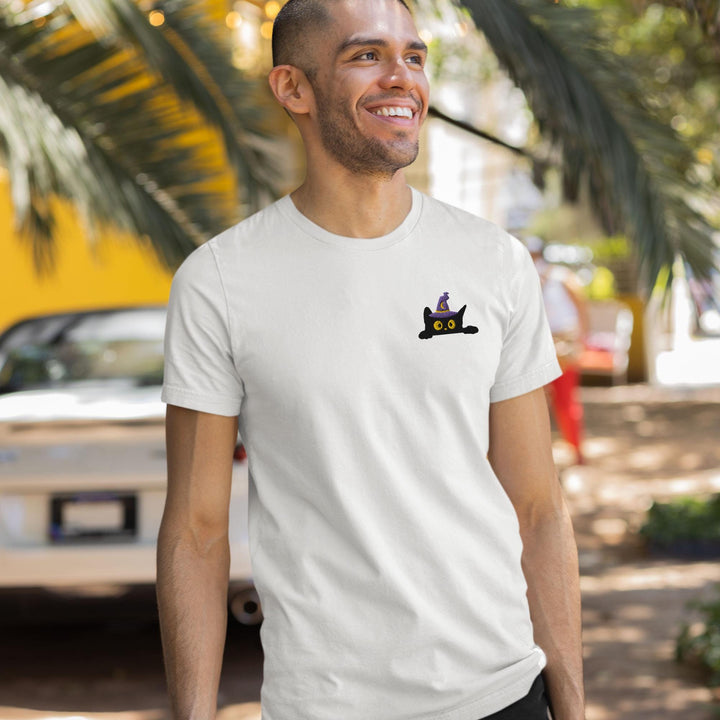 a man wearing a white t - shirt with a picture of a cat on it