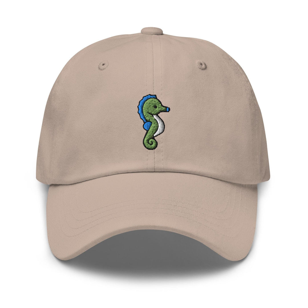 a tan hat with a seahorse embroidered on it