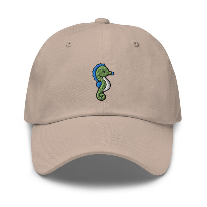 a tan hat with a seahorse embroidered on it