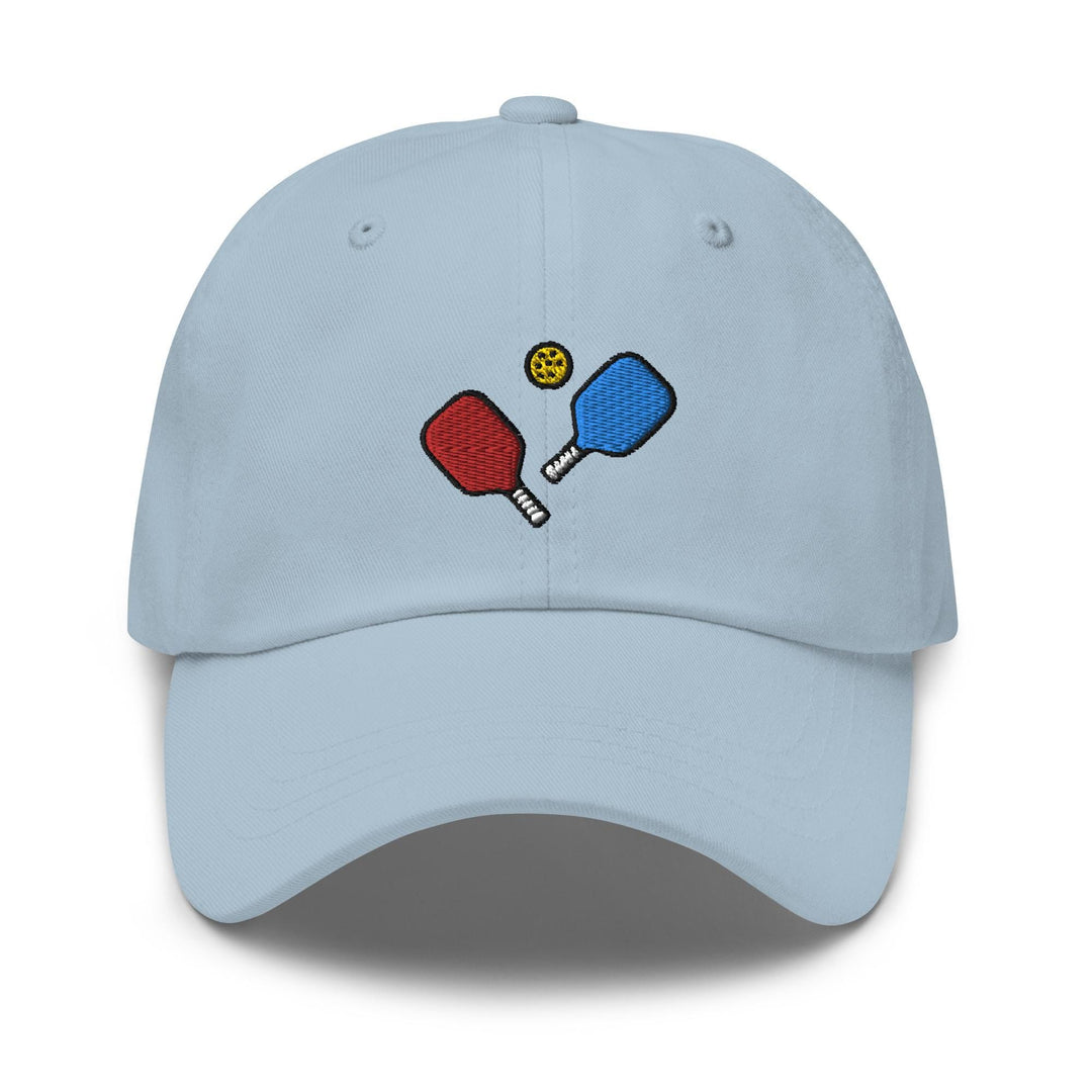 a blue hat with two ping pong paddles on it