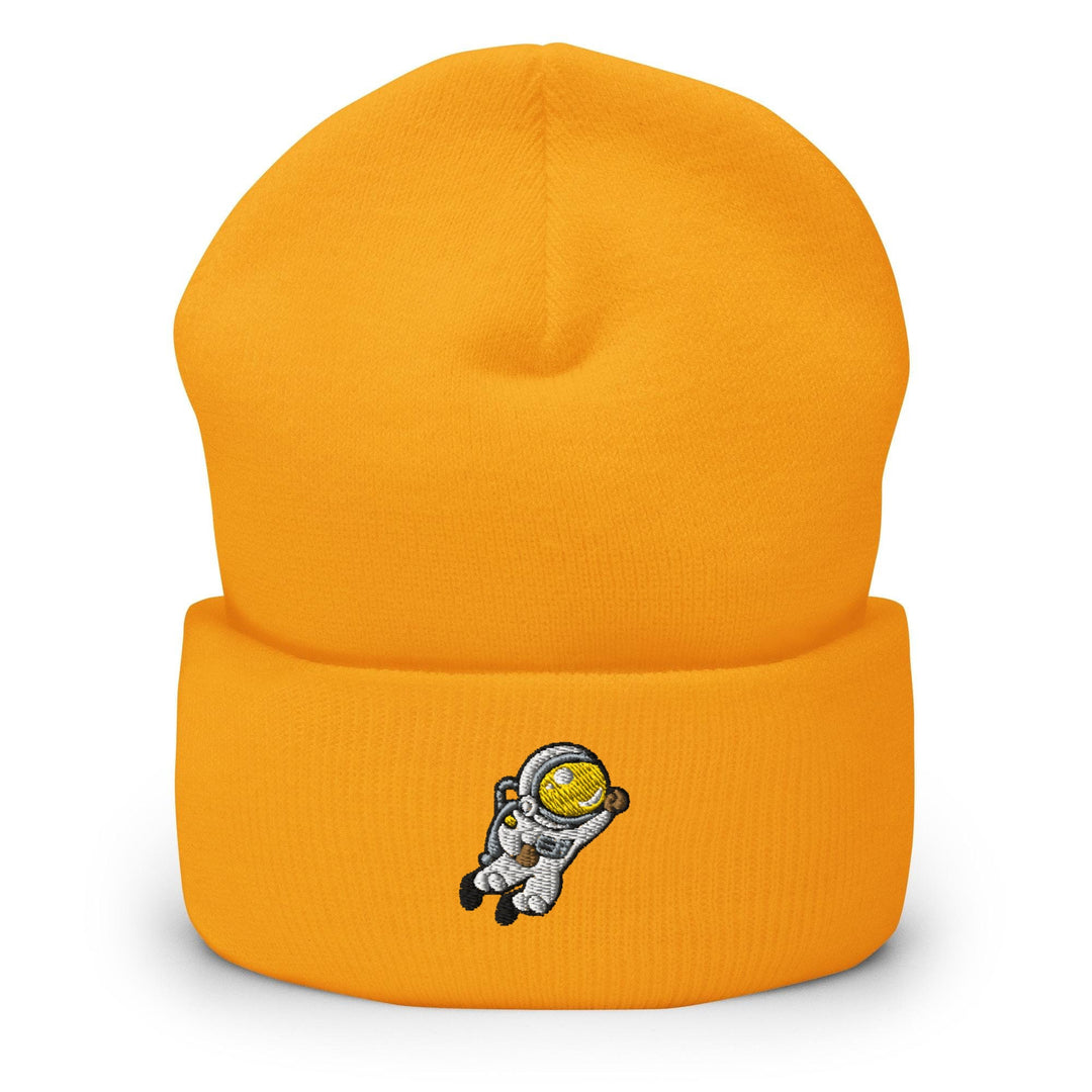 a yellow beanie with an astronaut on it