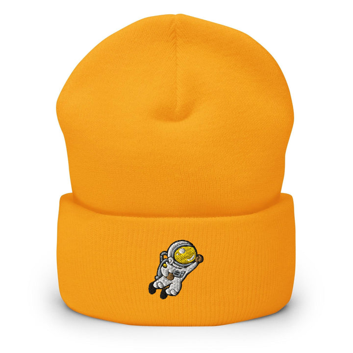 a yellow beanie with an astronaut on it