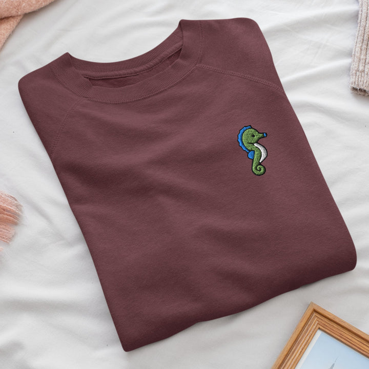 a t - shirt with a picture of a seahorse on it