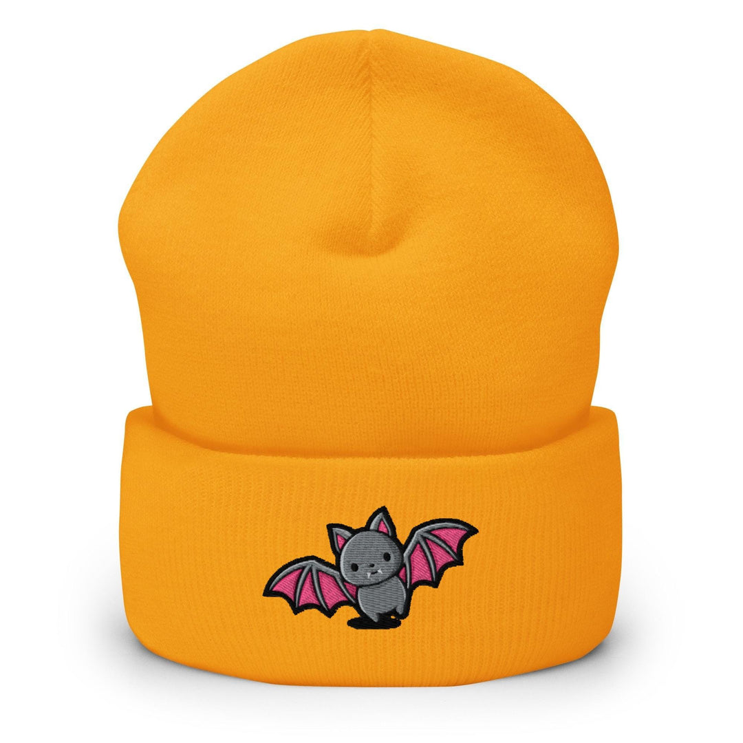 a yellow beanie with a bat embroidered on it