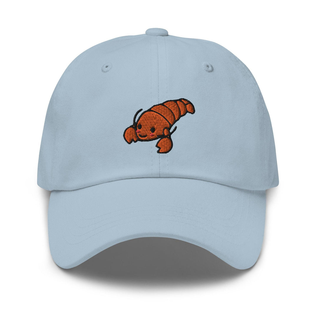 a light blue baseball cap with an orange fish embroidered on the front