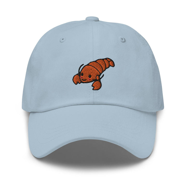 a light blue baseball cap with an orange fish embroidered on the front