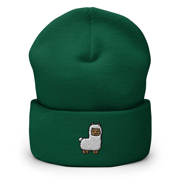 a green beanie with a white llama on it
