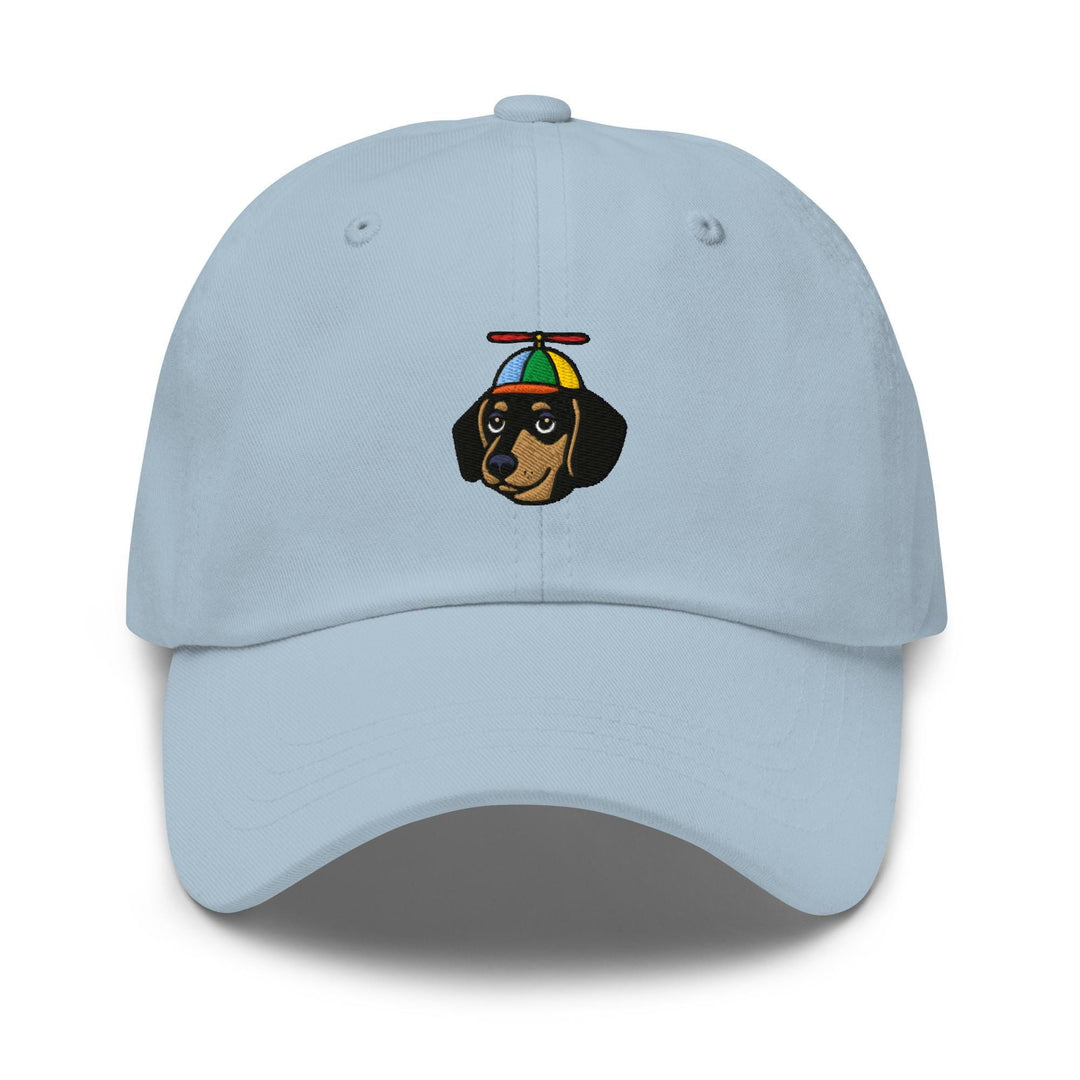 a light blue hat with a dachshund wearing a hat