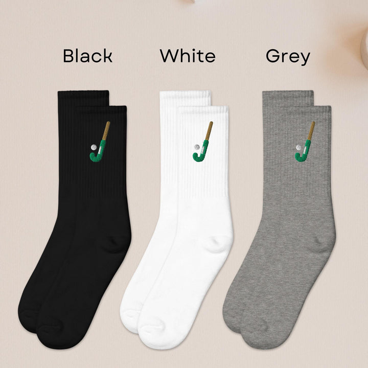 three pairs of black, white, and grey socks