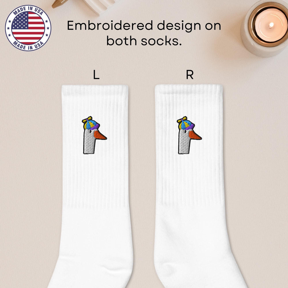 a pair of socks with a picture of a bird on it