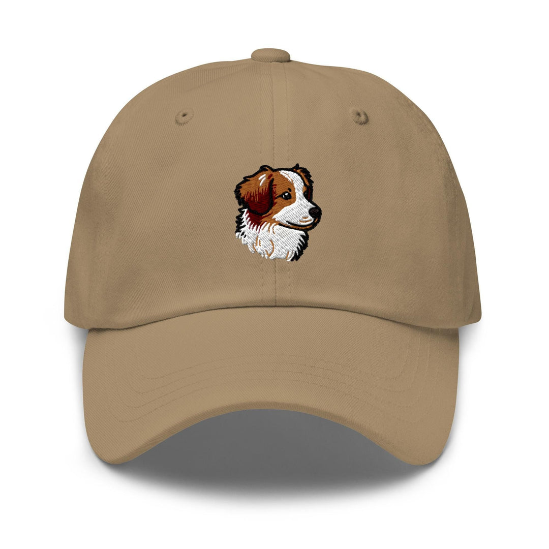 a tan hat with a brown and white dog on it