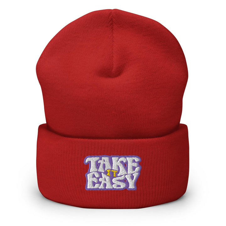 a red beanie with the words take easy on it