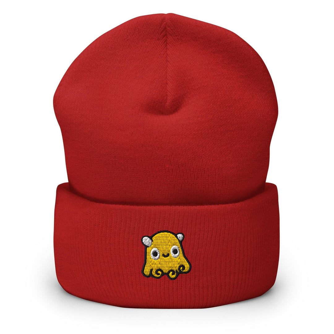 a red beanie with a cartoon character on it