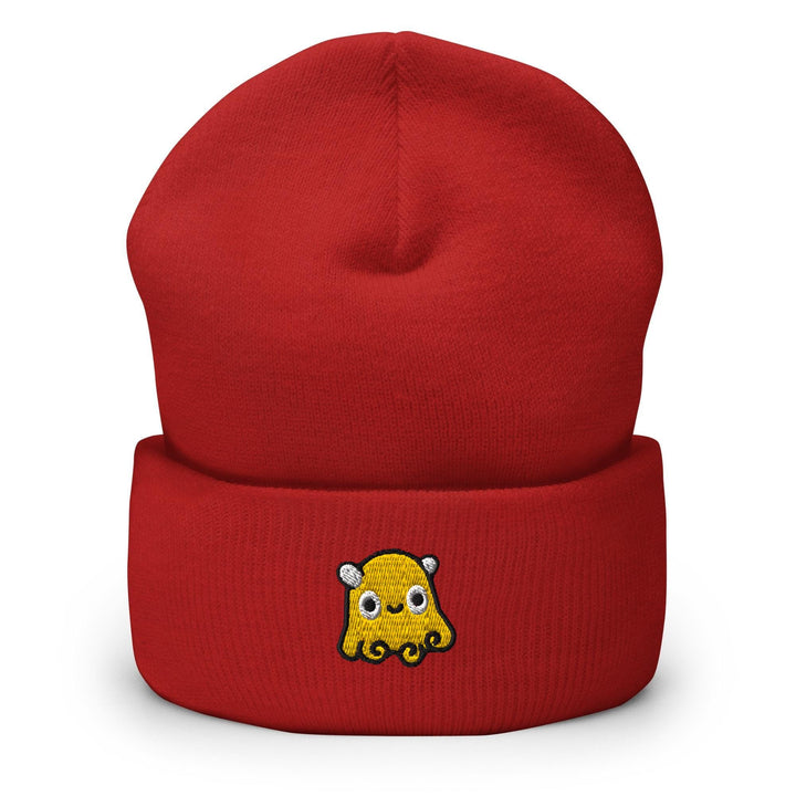 a red beanie with a cartoon character on it