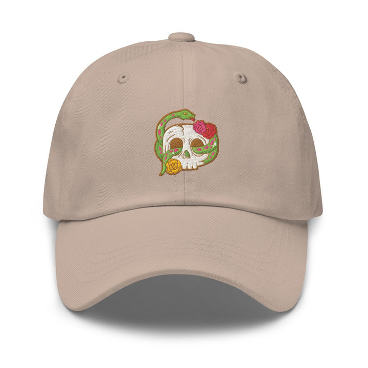 a baseball cap with a skull and flowers on it