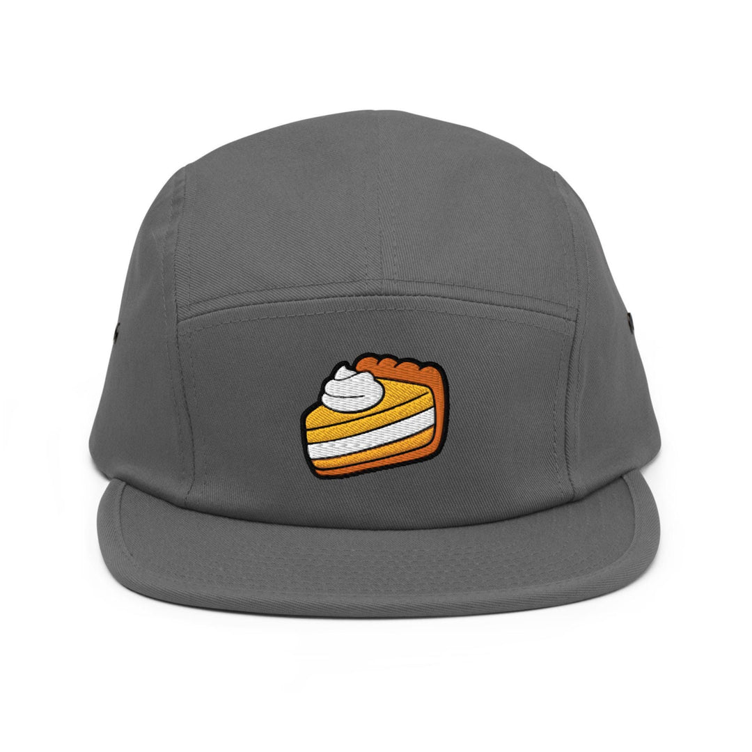 a grey hat with a piece of cake on it