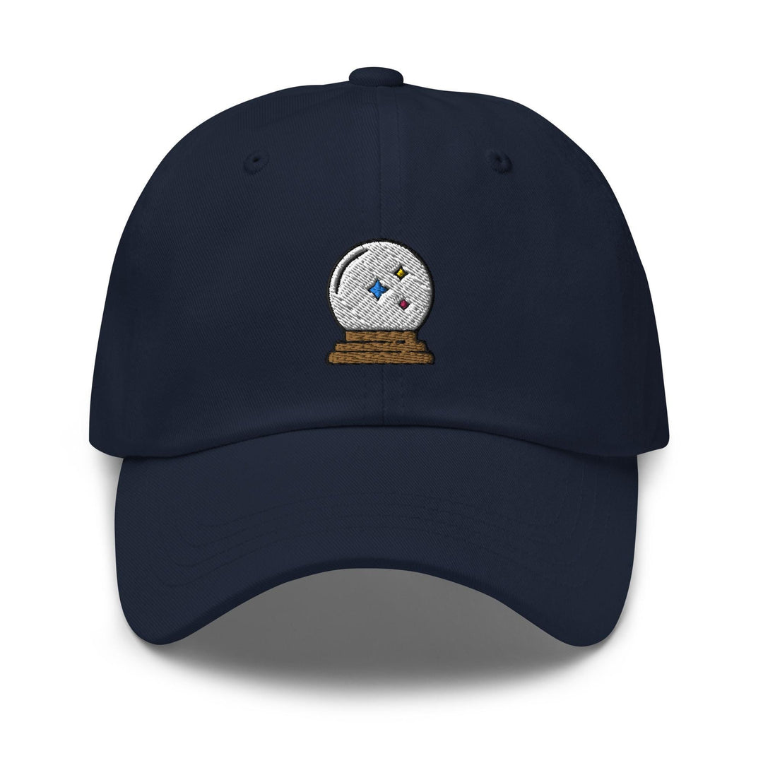 a blue hat with a white ball on top of it