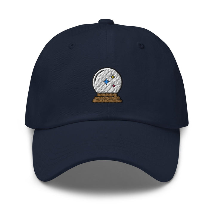 a blue hat with a white ball on top of it