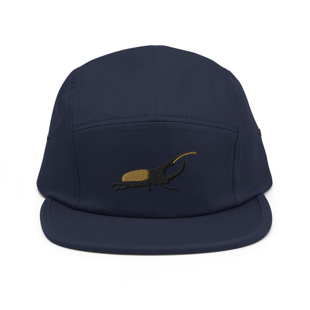 a blue hat with a lizard embroidered on it