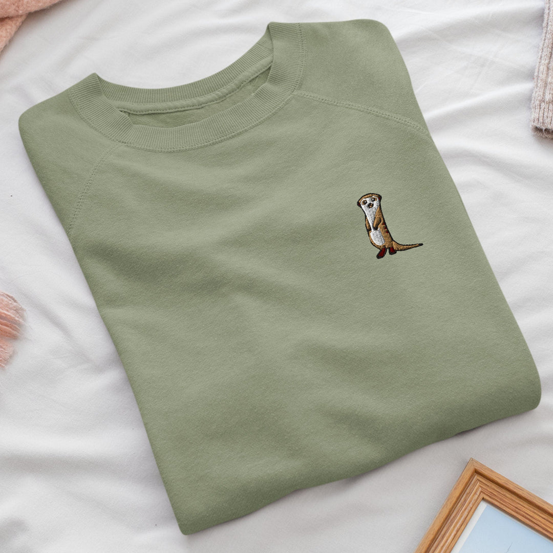 a t - shirt with a picture of an otter on it