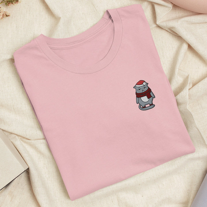 a pink t - shirt with a cartoon character on it