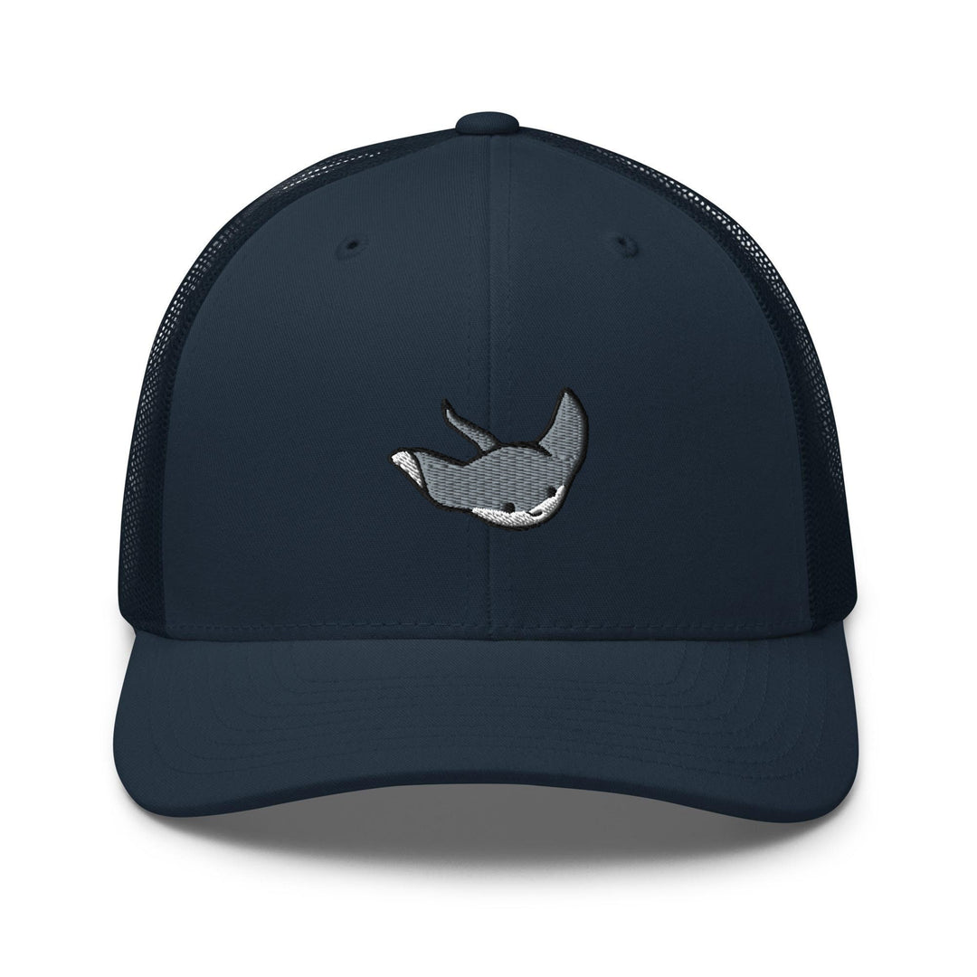 a blue trucker hat with a whale embroidered on the front