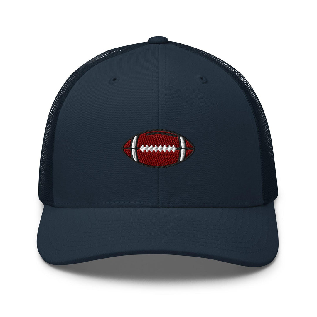 a blue trucker hat with a football embroidered on the front