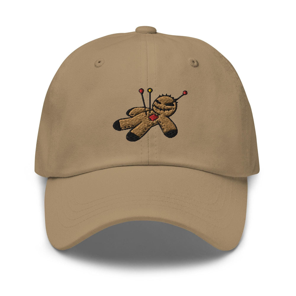 a tan baseball cap with a teddy bear holding a golf club