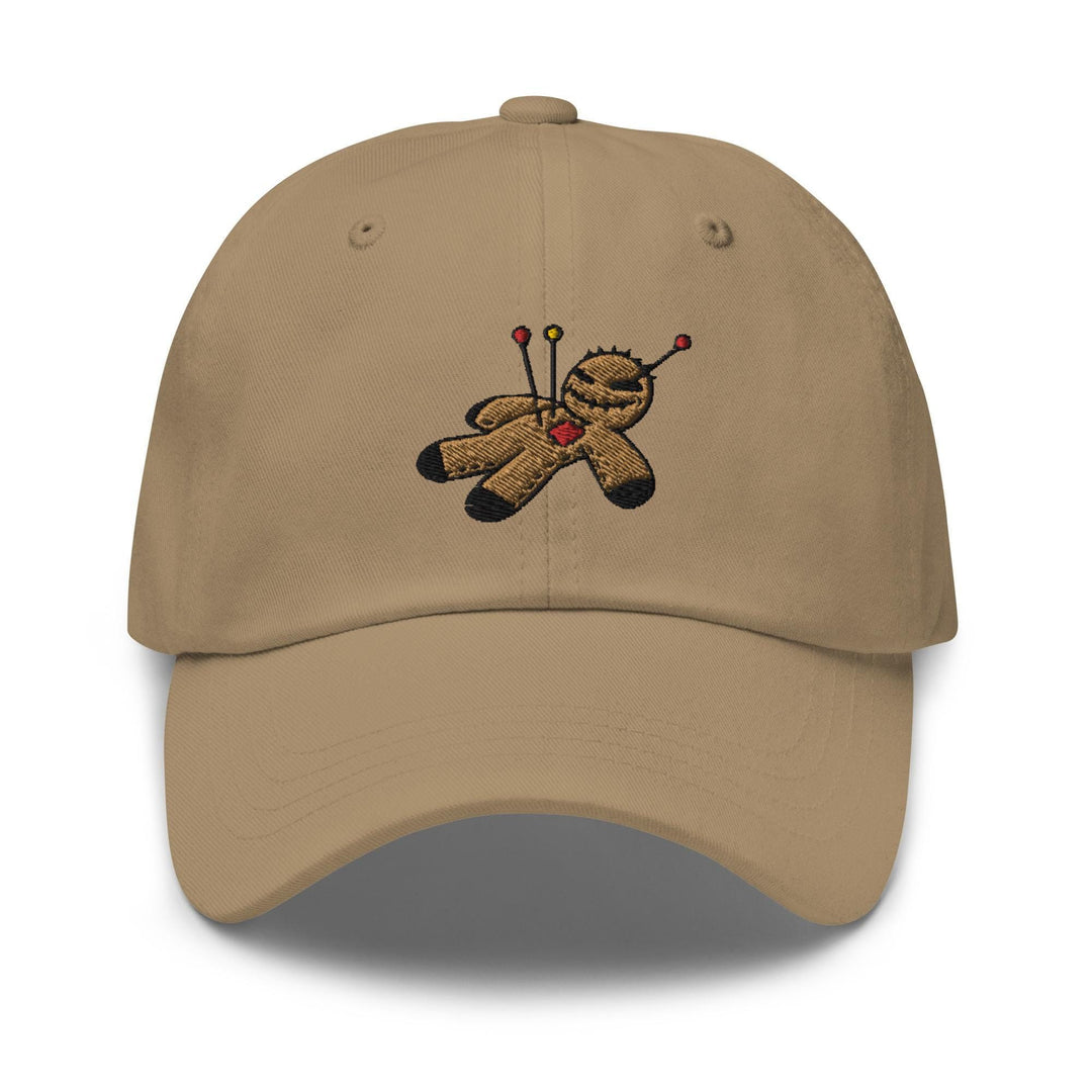 a tan baseball cap with a teddy bear holding a golf club