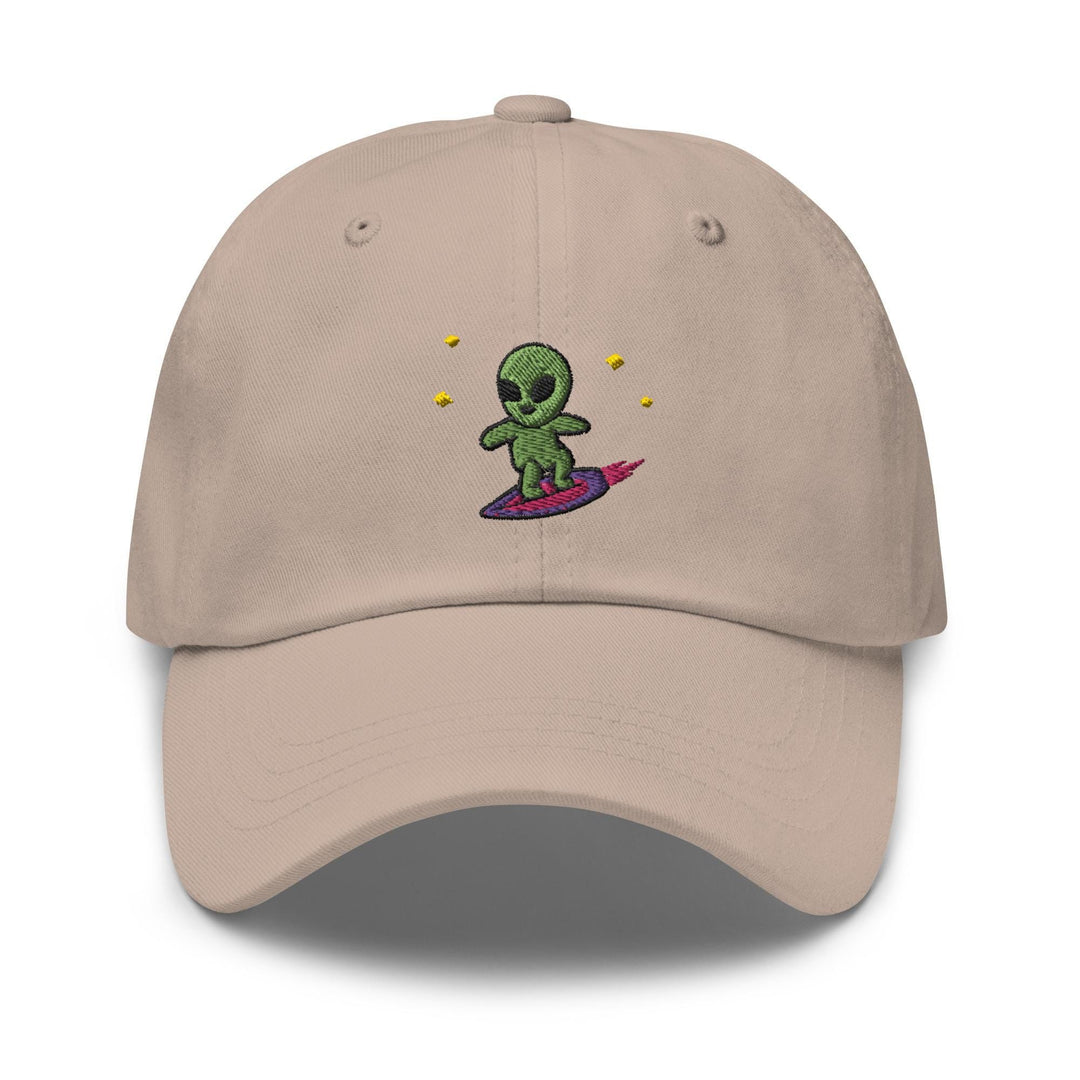 a baseball cap with an alien on a surfboard
