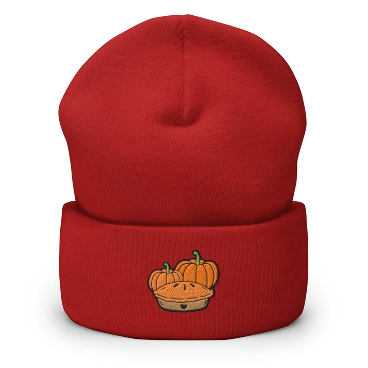 a red beanie with a cartoon pumpkin on it