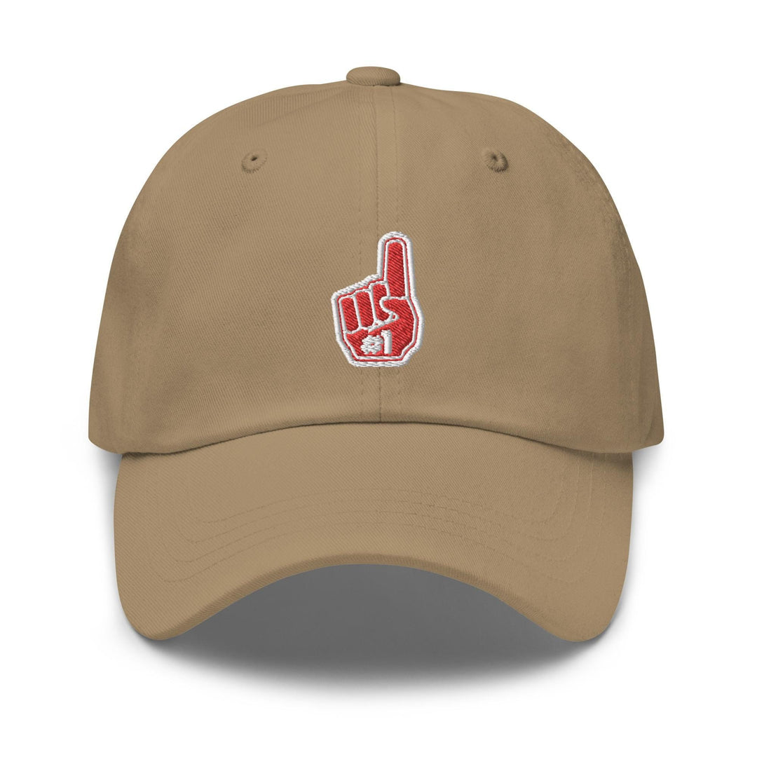 a tan baseball cap with a red peace sign on it