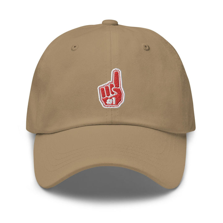 a tan baseball cap with a red peace sign on it