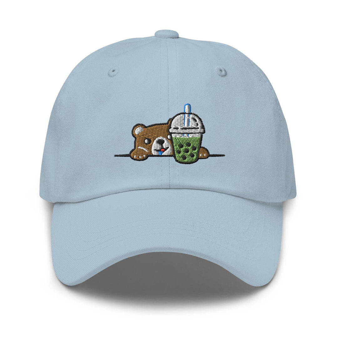 a light blue hat with a bear holding a drink