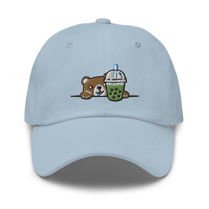 a light blue hat with a bear holding a drink