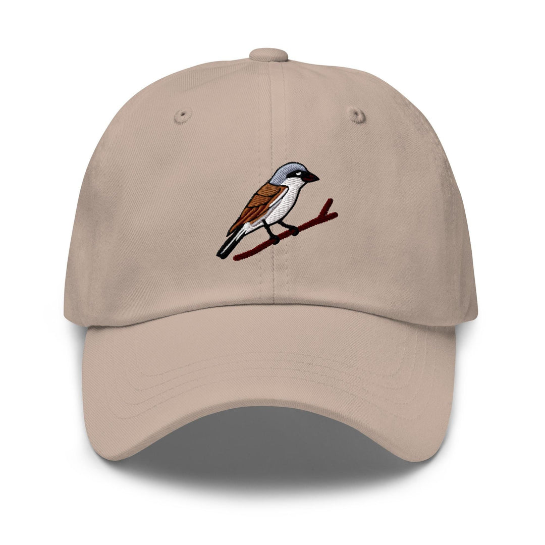 a tan hat with a bird on it