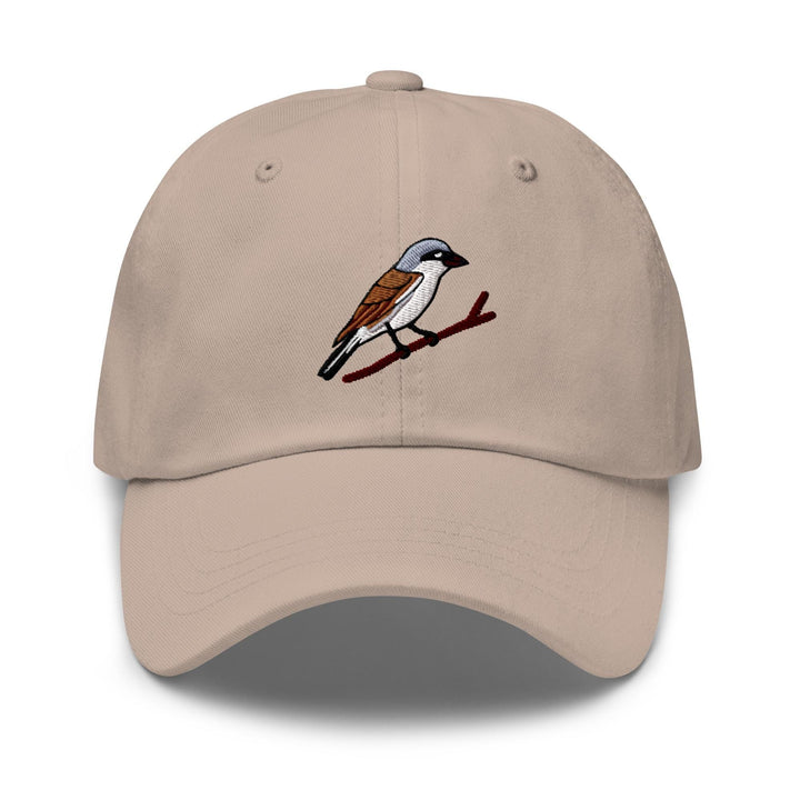 a tan hat with a bird on it