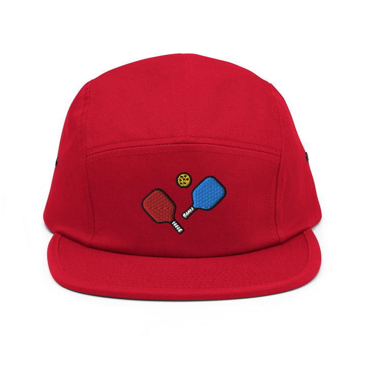 a red hat with two ping pong paddles on it