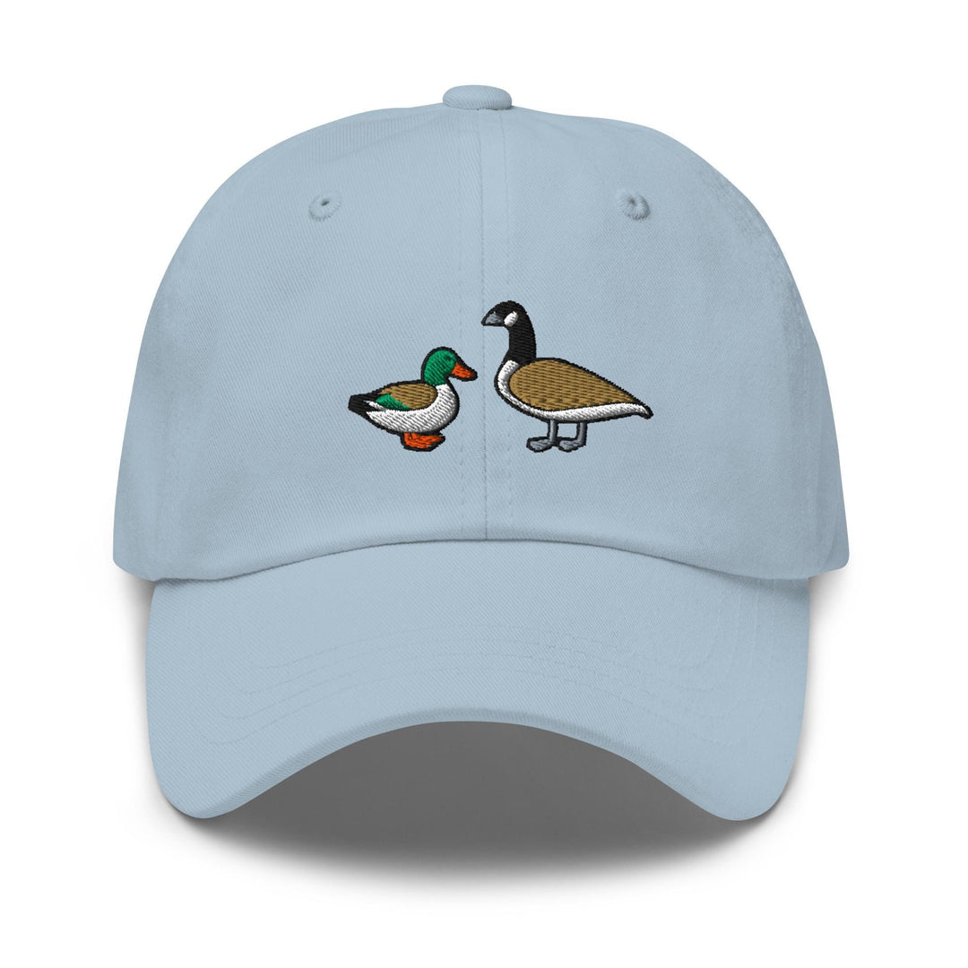 a light blue hat with two ducks on it