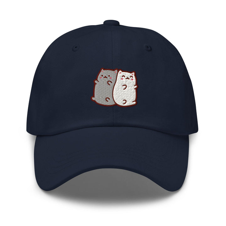 a baseball cap with two cats on it