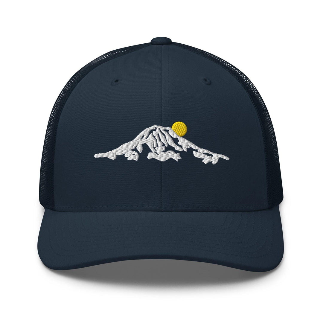 a trucker hat with a mountain and a sun on it