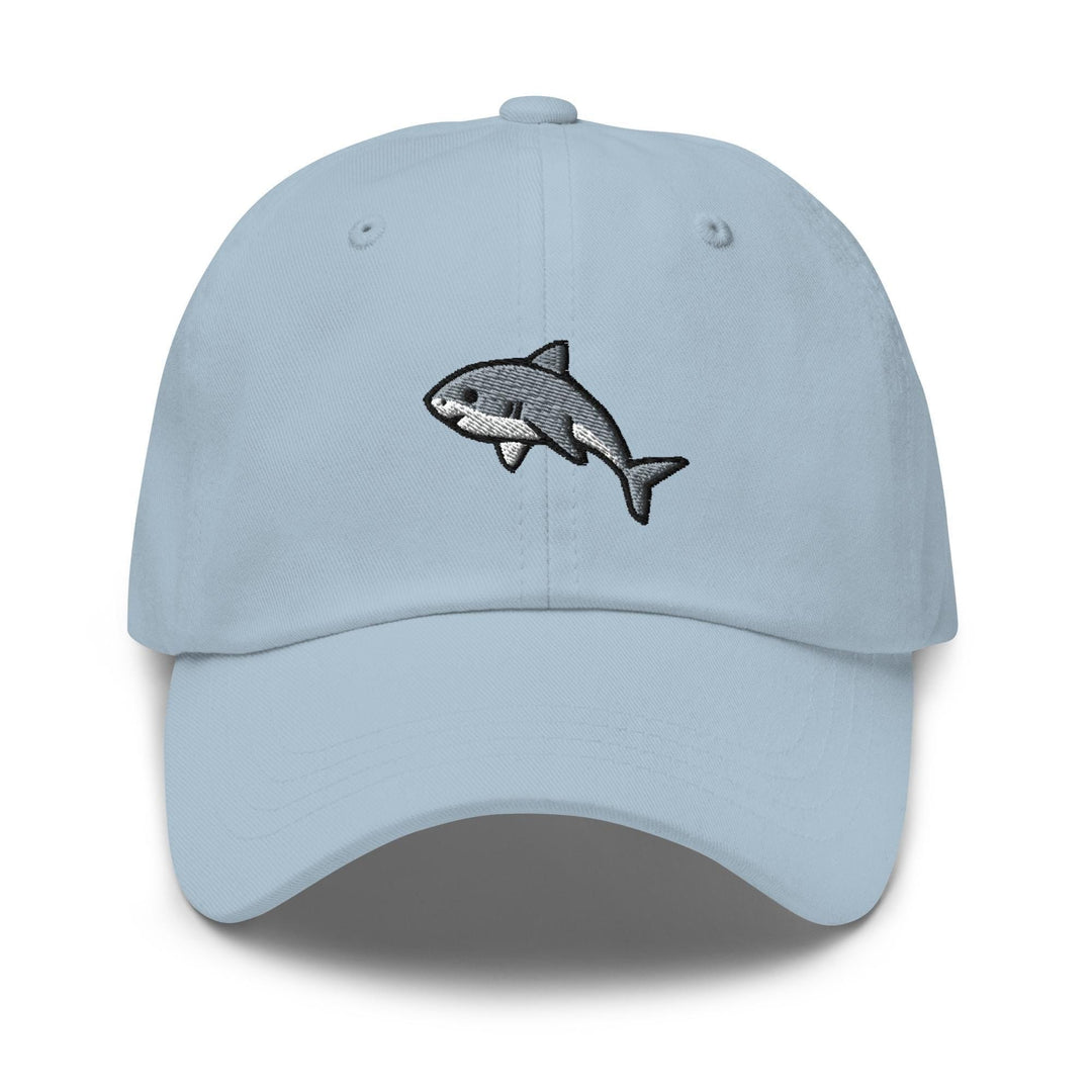 a light blue hat with a shark embroidered on it