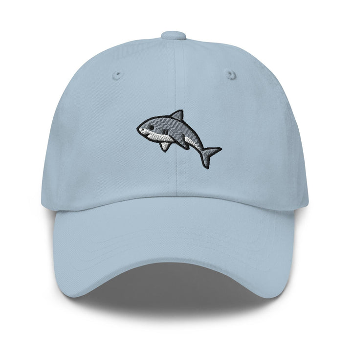 a light blue hat with a shark embroidered on it