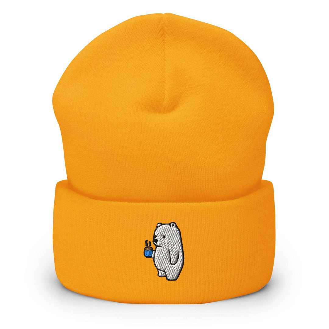 a yellow beanie with a white bear on it