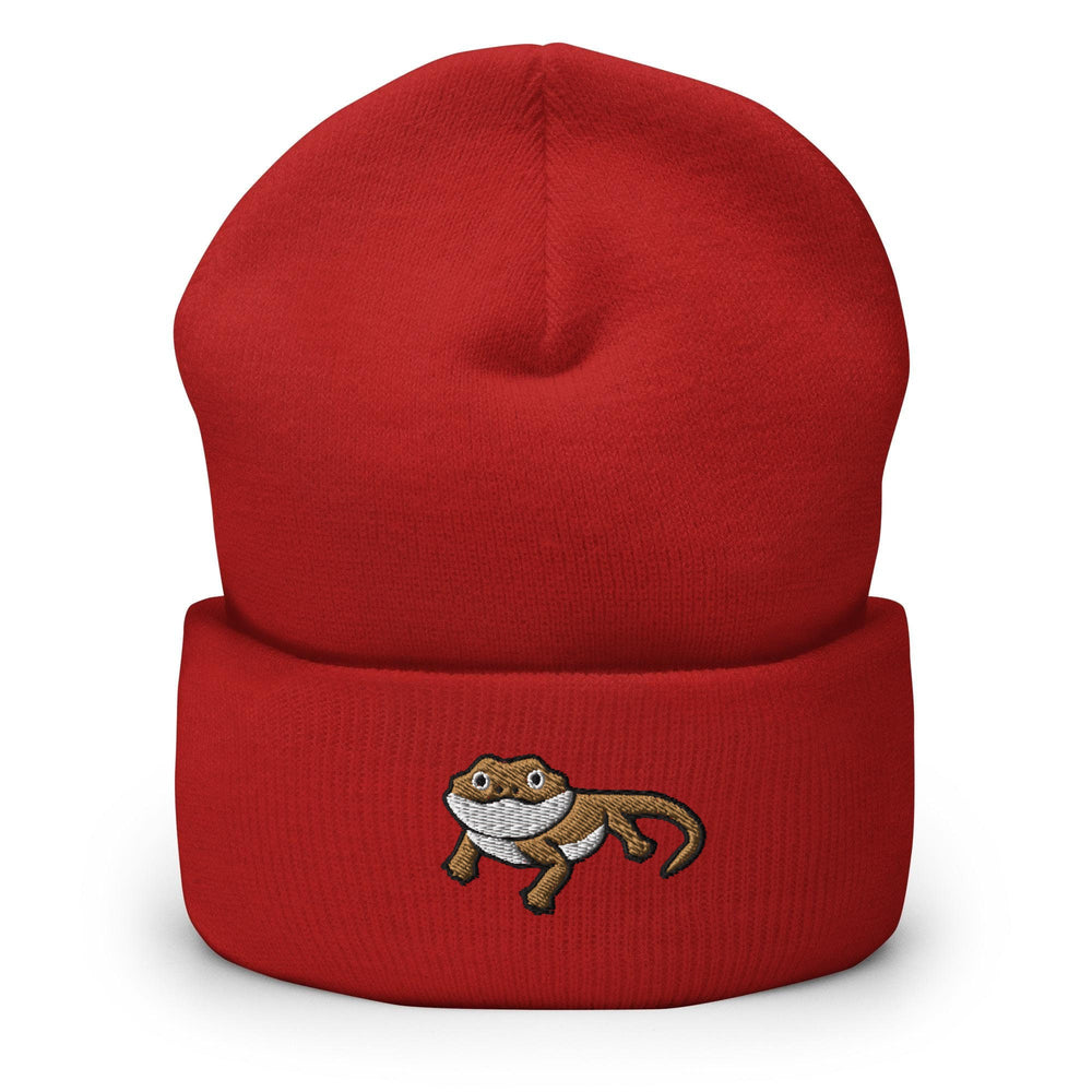 a red beanie with a monkey embroidered on it